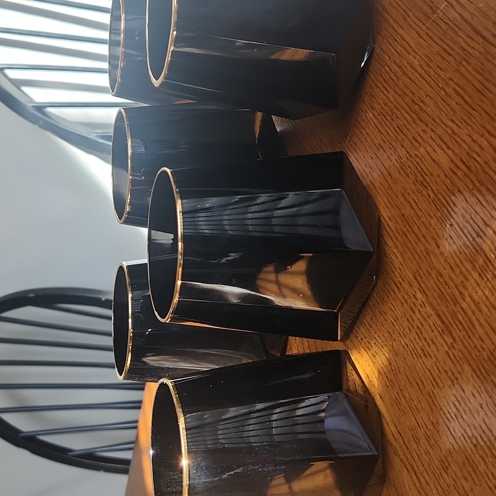 Decagon shaped black and gold drink glasses